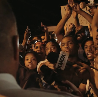 Fareed documenting Ferguson protests during the Twelve Days in Ferguson project